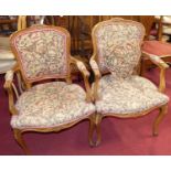 A pair of French provincial walnut framed and floral needlework upholstered fauteuil, w.59cm