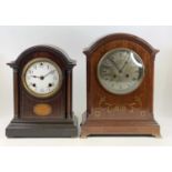 An Edwardian inlaid mahogany dome topped mantel clock, having unsigned silvered dial, h.31cm;