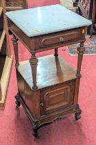 A mid-19th century French mahogany and white marble topped free standing two-tier wash stand, having