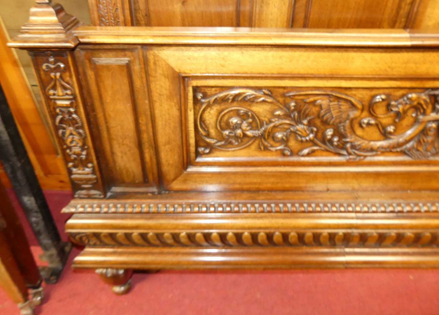 An early 20th century French relief carved walnut king size bedstead, the headboard with - Image 2 of 3