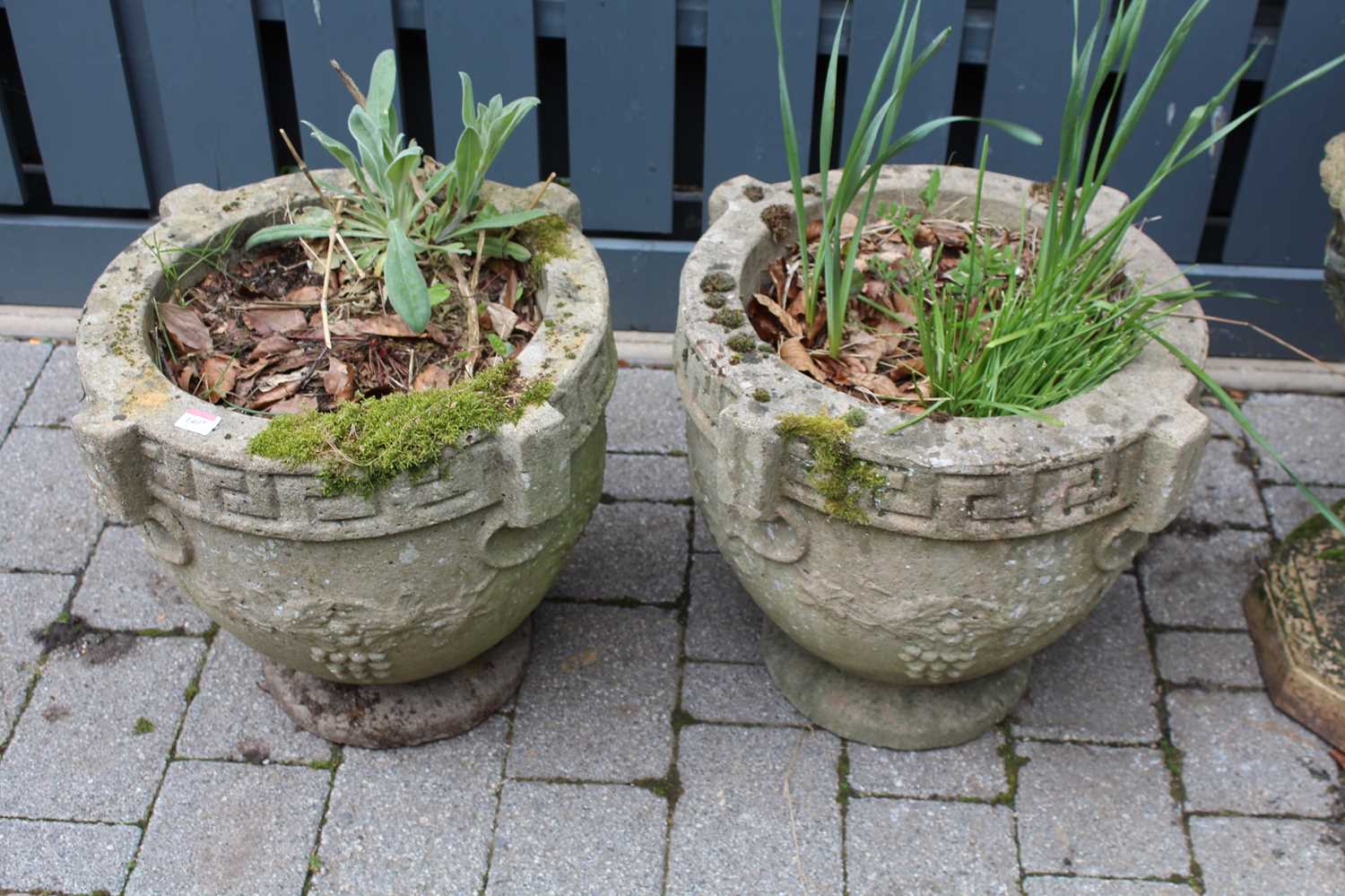 A pair of reconstituted stone circular pedestal garden planters, in the classical taste, dia. 45.