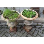 A pair of white painted cast iron pedestal garden urns, in the classical taste, height 50cm