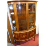 An Edwardian mahogany and floral satin wood inlaid demi-lune double door glazed china display