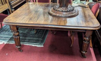 A mid-Victorian mahogany round cornered extending dining table, having wind-out action and two extra