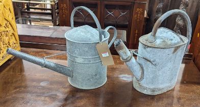 Two galvanised metal watering cans Both appear to be free of holes but have not been tested to see