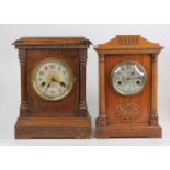 An early 20th century oak mantel clock, the dial signed by the retailer GW Wilson of Bury St