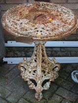 A cast and pierced metal circular garden table on pedestal base, dia. 57cm Very rusty.Cast iron.