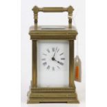 An early 20th century French lacquered brass carriage clock, having white enamelled dial, visible