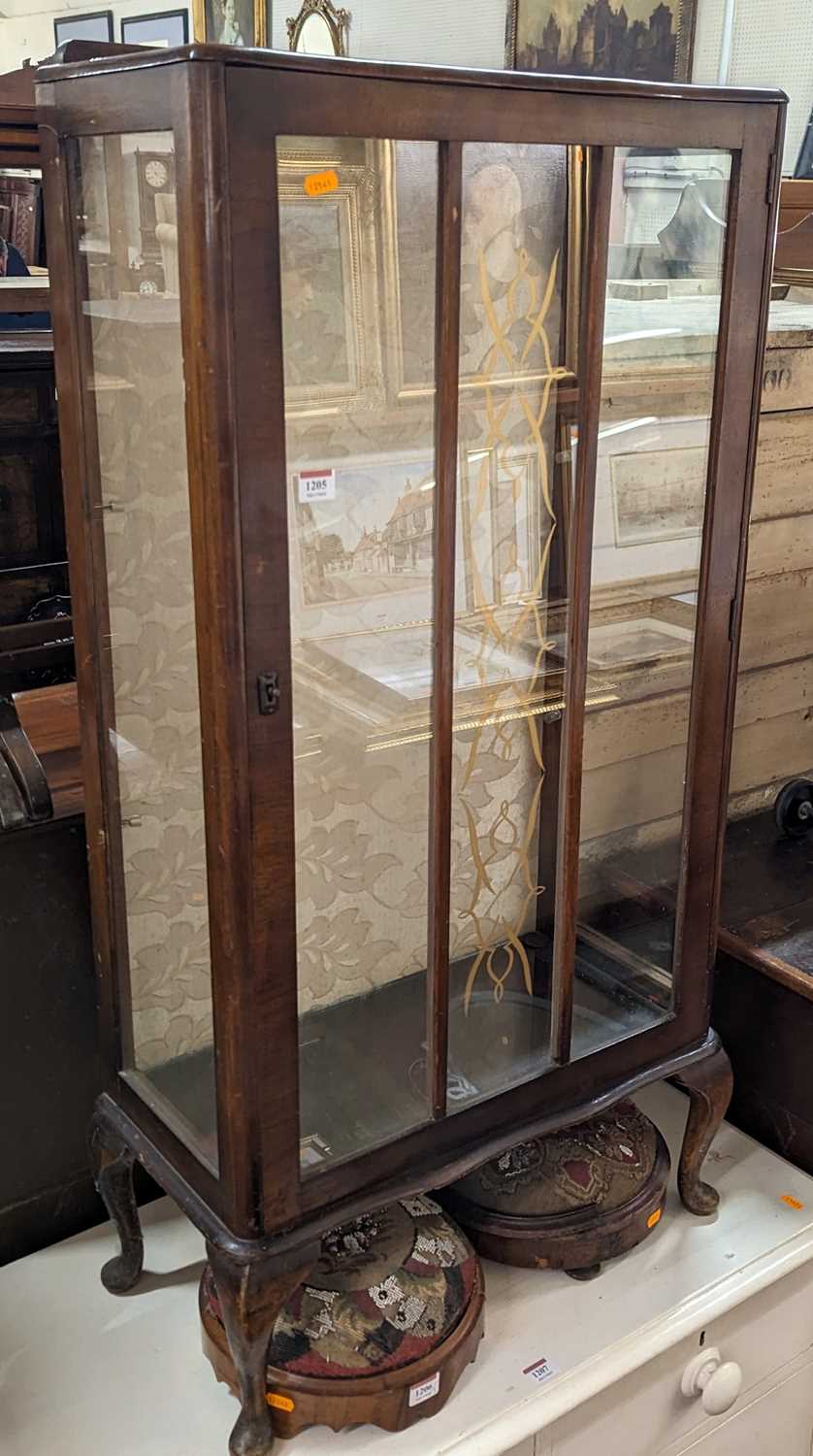 A 1930s walnut single door glazed china display cabinet, width 59cm