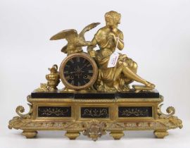 A French gilt brass and black slate mantel clock, the dial flanked by a maiden with bird of prey,