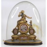 A late 19th century French gilt metal and porcelain mantel clock, surmounted with a maiden having