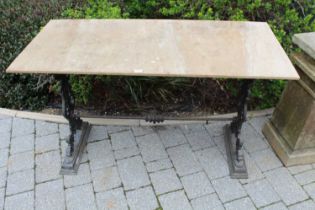 A black painted cast iron based and later ply-topped garden potting-up table, width 122cm