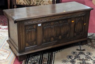 A linenfold moulded oak three panelled hinge top blanket box, width 95.5cm