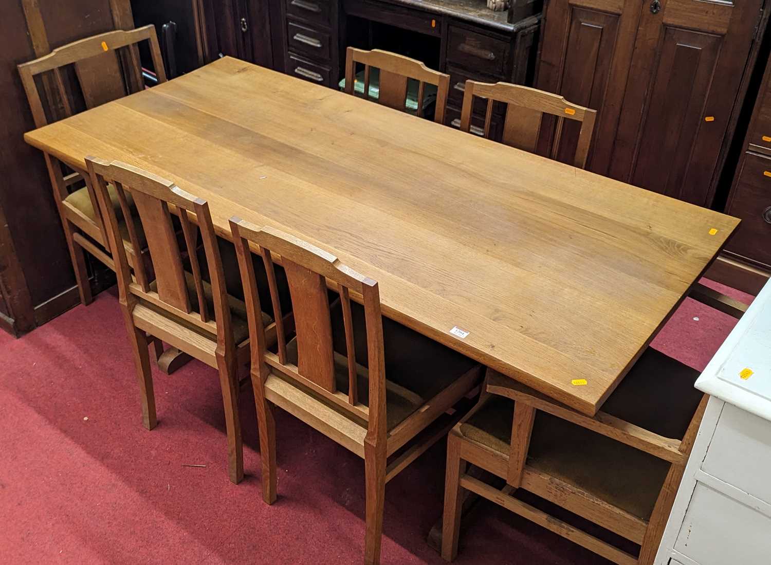 A blond oak dining suite comprising refectory dining table, length 168cm, together with a set of six