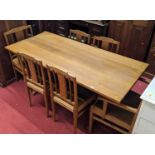 A blond oak dining suite comprising refectory dining table, length 168cm, together with a set of six