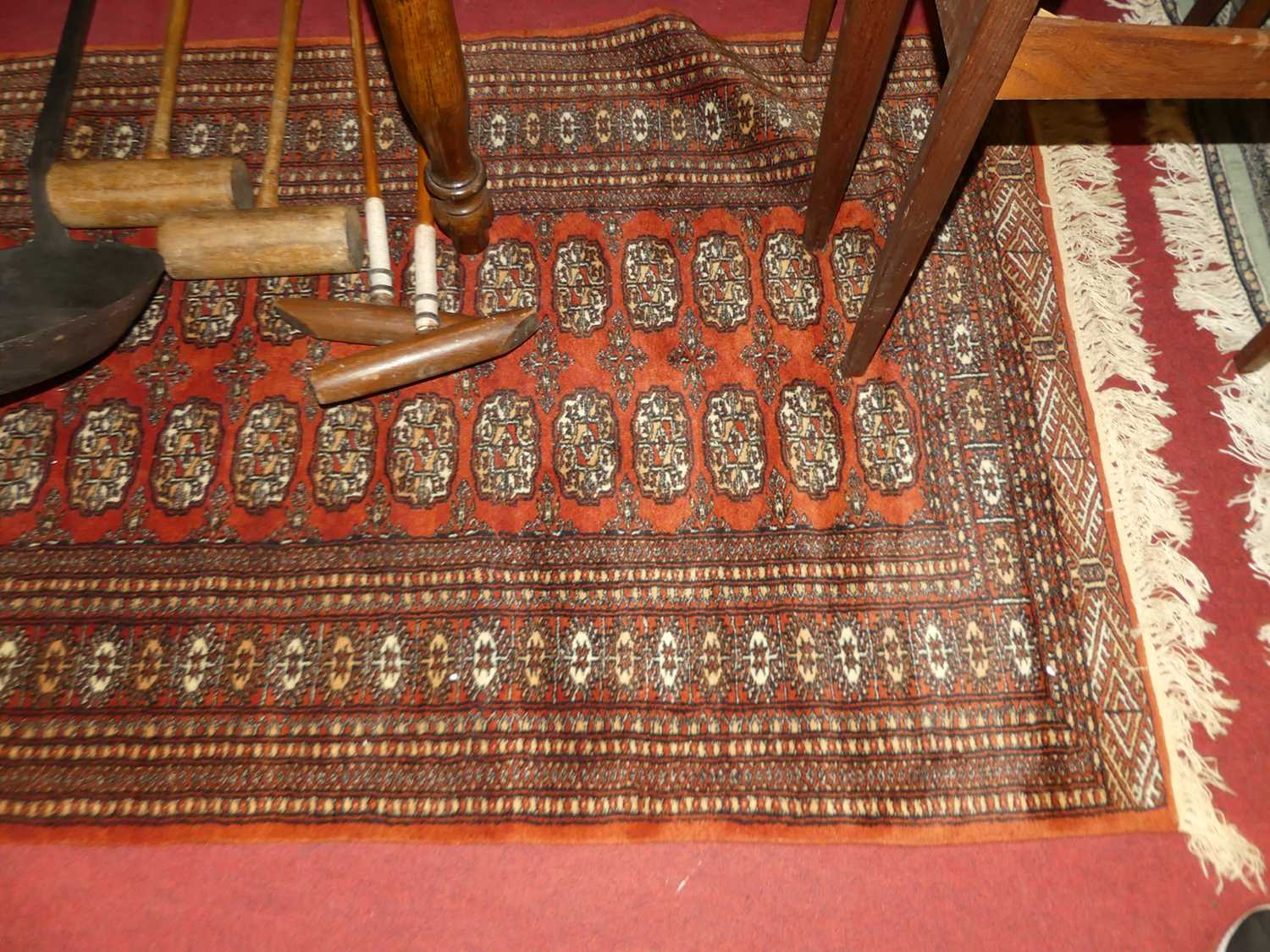A Persian woollen green ground Bokhara rug, 190 x 130cm, together with a further Persian woollen red - Image 2 of 2