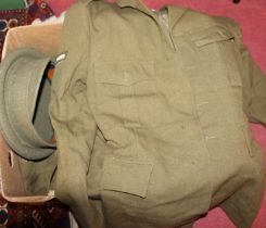 A collection of assorted uniforms and ephemera, to include WWII Military Police webbing holster,