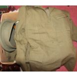 A collection of assorted uniforms and ephemera, to include WWII Military Police webbing holster,