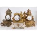 A 19th century French gilt metal mantel clock; together with four other examples, all with losses