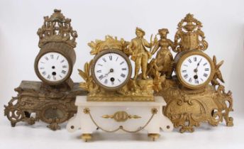 A 19th century French gilt metal mantel clock; together with four other examples, all with losses