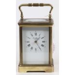 An early 20th century lacquered brass carriage clock, having visible platform escapement, the