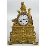 A 19th century French gilt bronze and brass mantel clock, the whole surmounted with kneeling girl,