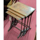 An early 20th century mahogany, flame mahogany and chequer inlaid nest of three occasional tables,