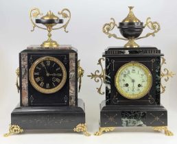 A late Victorian polished slate and marble mantel clock, surmounted with a pedestal urn, having a