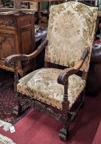 An early 20th century French walnut and acanthus leaf carved open armchair, having floral