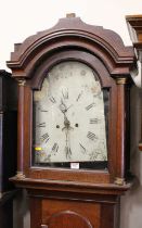 An early 19th century oak long case clock having unsigned 12" painted arch dial, twin winding
