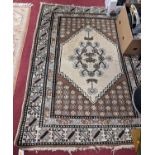 A Persian woollen cream and brown ground Catawiki rug, 165 x 125cm
