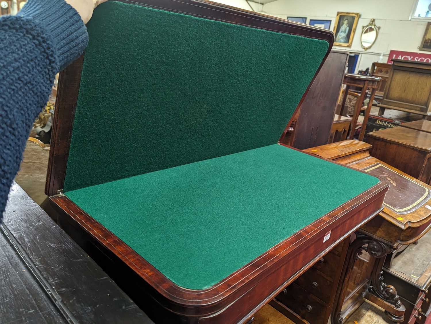 An early Victorian mahogany round cornered fold-over card table, having a baized lined interior, - Image 2 of 2