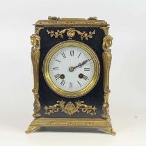 A circa 1900 gilt brass and ebonised mantel clock having unsigned white enamel dial and with brass