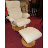 A contemporary cream leather upholstered swivel armchair, with matching footstool, on circular