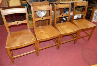 A set of four early 19th century East Anglian elm panelled seat barback dining chairs, w.44cm All