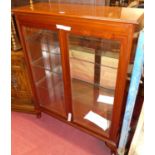 A contemporary mahogany double bevelled glass display cabinet, having interior mirrored back and
