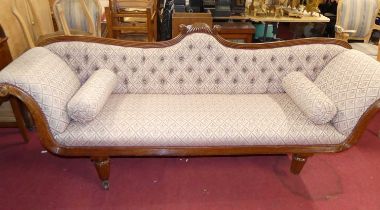 A Regency mahogany scroll-end four-seater sofa, floral button back fabric upholstered, raised on