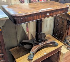 An early Victorian mahogany round cornered fold-over card table, having a baized lined interior,