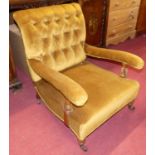 A mid-Victorian mahogany framed mustard buttoned dralon upholstered open armchair, raised on squat