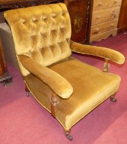 A mid-Victorian mahogany framed mustard buttoned dralon upholstered open armchair, raised on squat