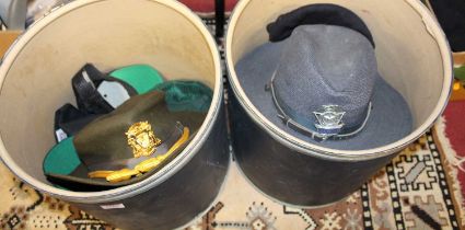 Two boxes of assorted hats, to include Police Insignia Collectors Association baseball caps,