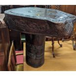 An Indonesian Saur tree slab table from the island of Timor, with stylised carved banded design,