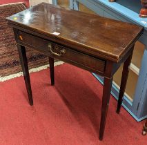 A George III mahogany fold-over tea table, with rear gateleg action and single frieze drawer,