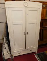 A cream painted pine double door wardrobe, with twin short lower drawers, width 107cm