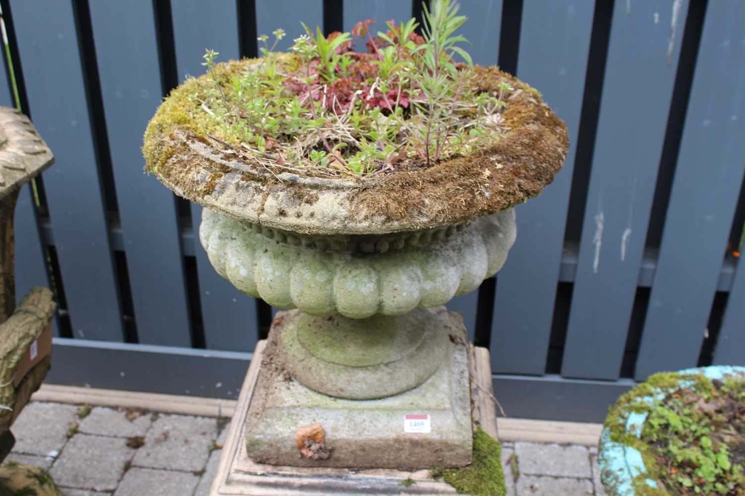 A reconstituted stone pedestal planter, raised on associated square stepped base, overall height - Image 2 of 3