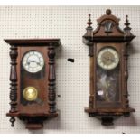 A circa 1900 Vienna walnut droptrunk wall clock, h.72cm; together with another similar (2)