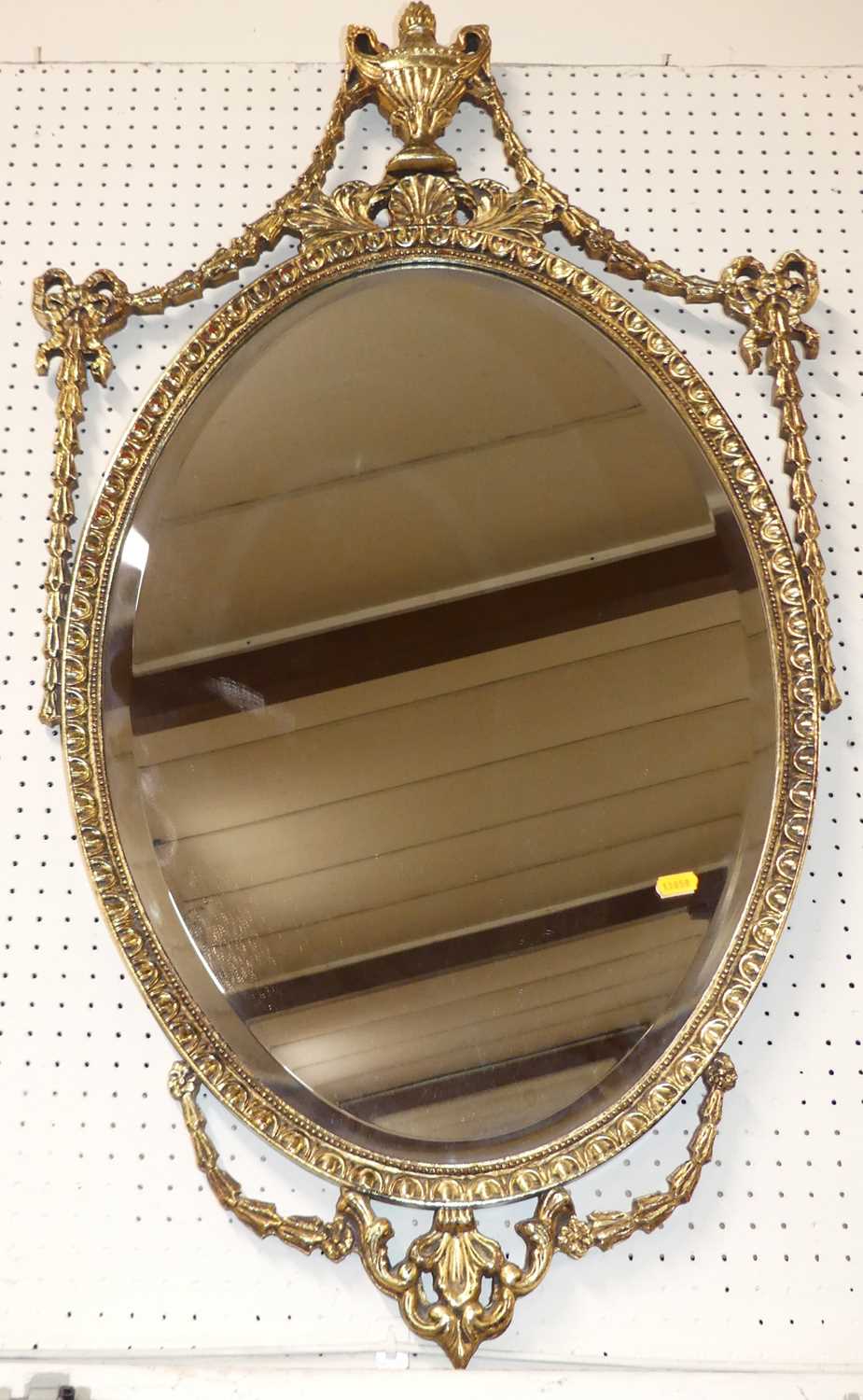 A reproduction gilt composition framed wall mirror in the Adam style, w.97cm; together with a gilt - Image 2 of 2