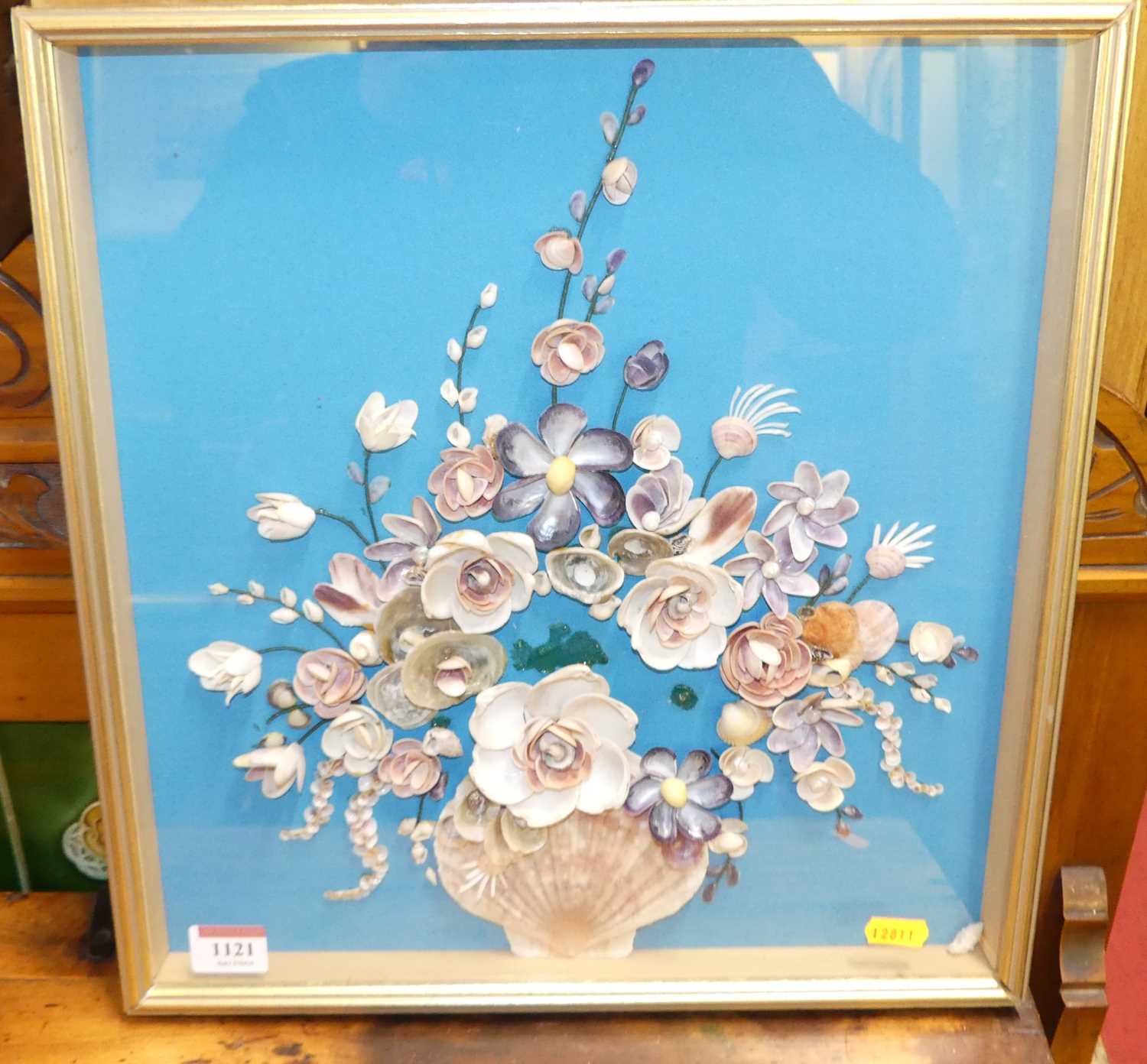 A framed display of shell art, 37 x 35cm