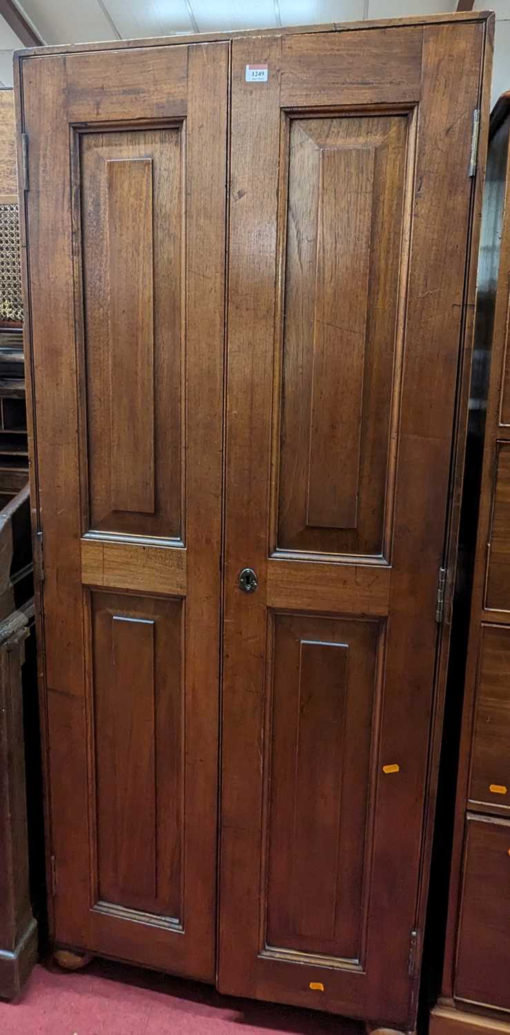 A 19th century mahogany twin recessed panelled twin door hall cupboard, width 73cm