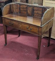 An early 19th century mahogany tambour top desk, the interior fitted with various drawers and
